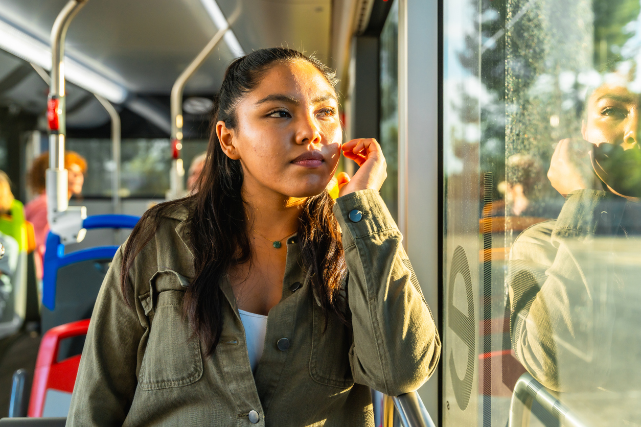 Woman commuting on the bus from an individual outpatient session