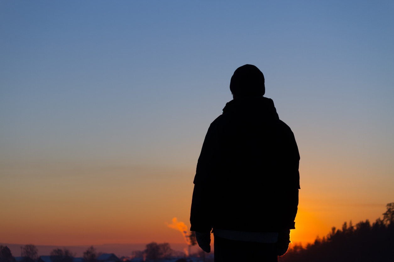 Man staring at the sunset