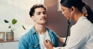 Clinician listening to the heartbeat of a patient going through withdrawal