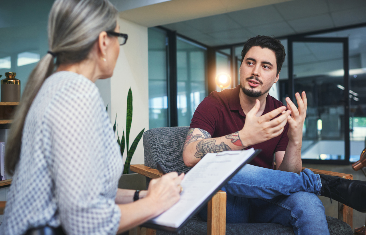 Man meeting with counselor