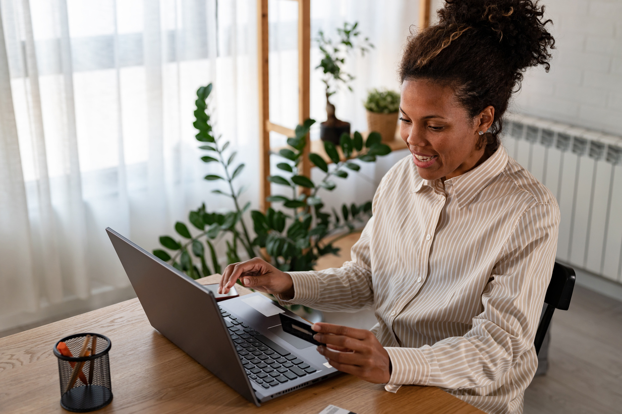 Woman signing up on laptop