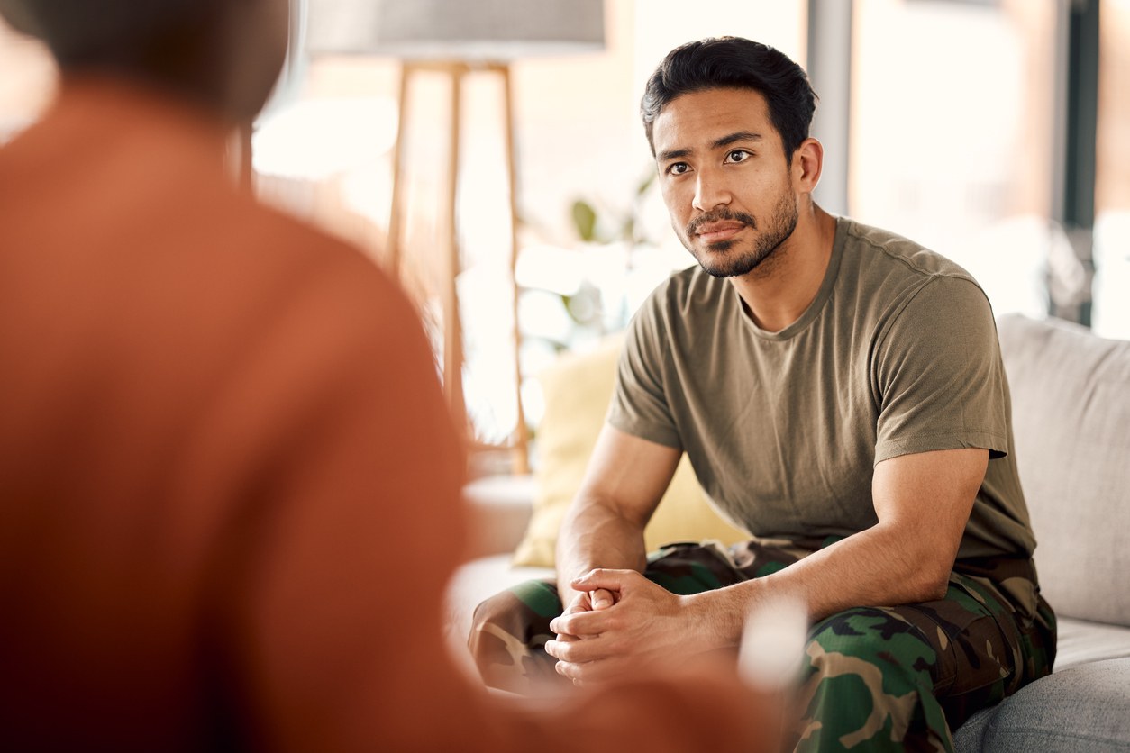 Man seated in an individual therapy session