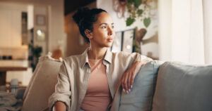 Woman looking hopefully out the window