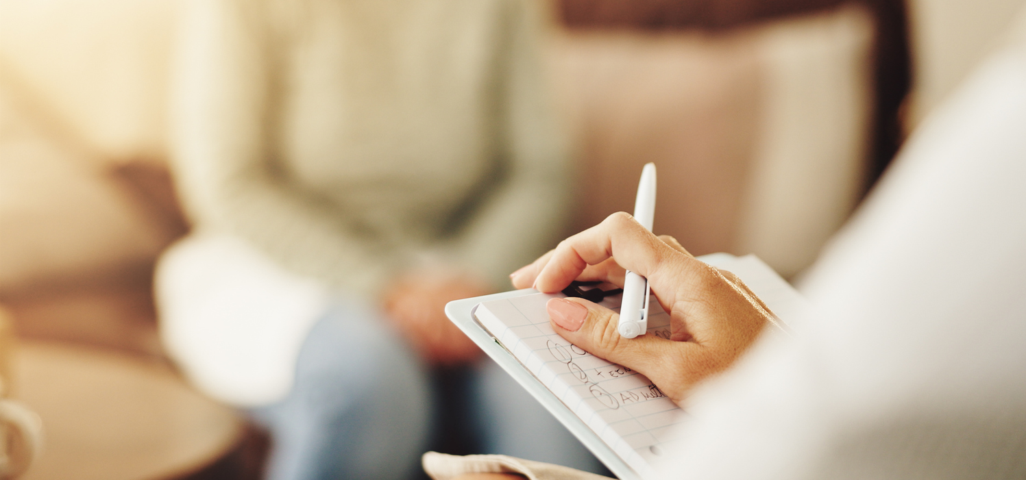 Clinician prescribing medication to help a patient in recovery