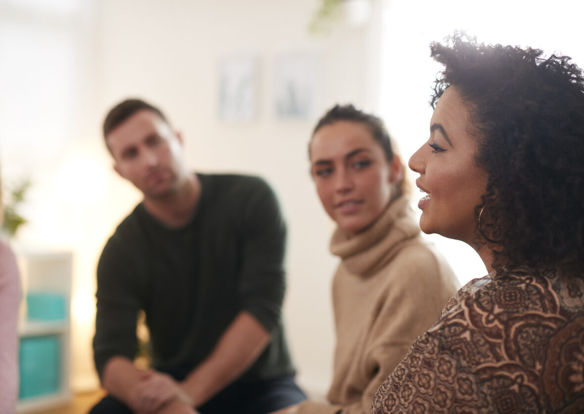 Woman speaking in an addiction support group