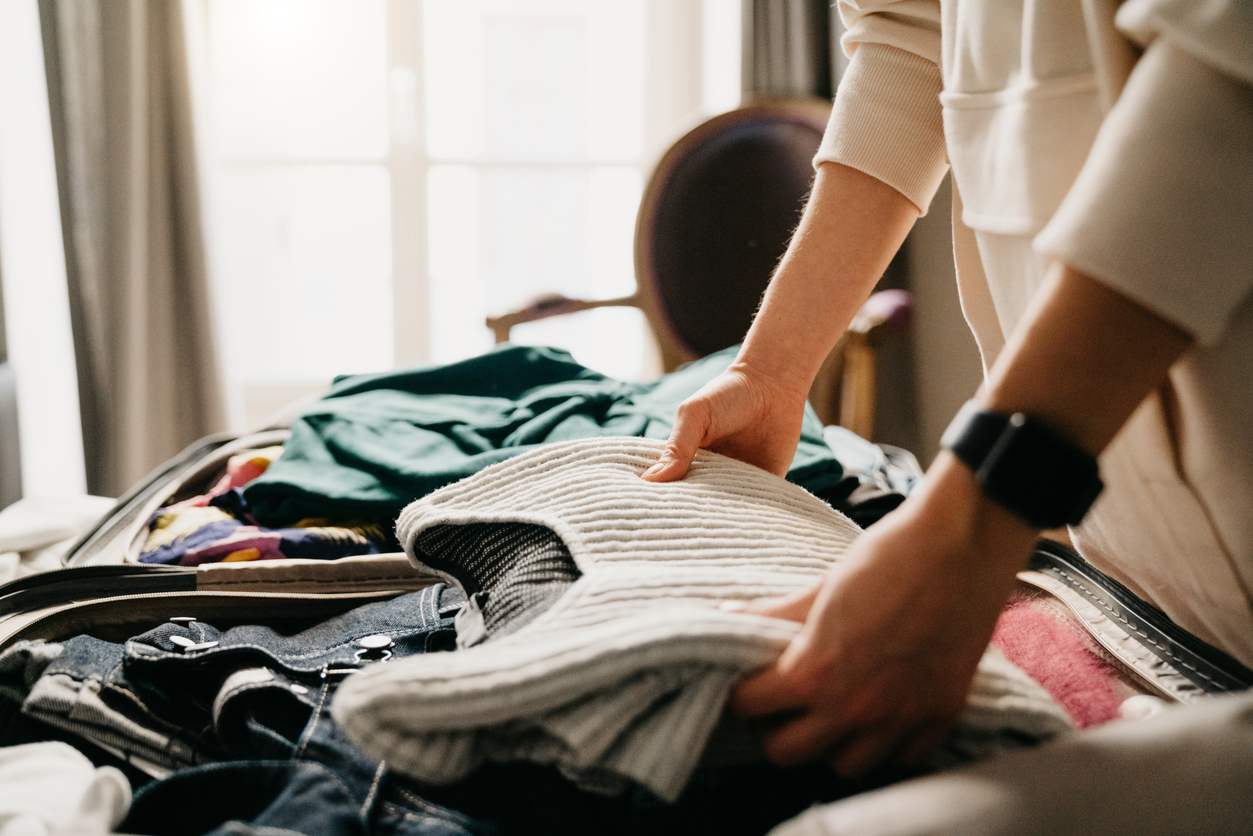 A woman is packing for residential treatment